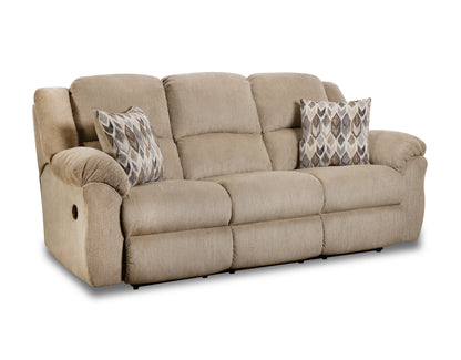 Beige sofa with patterned pillows on a white background