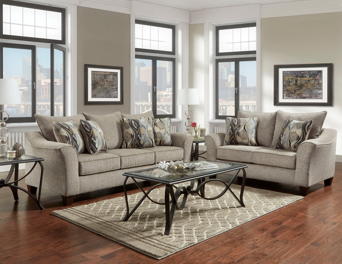 Living room with gray sofas, a coffee table, and decorative elements.