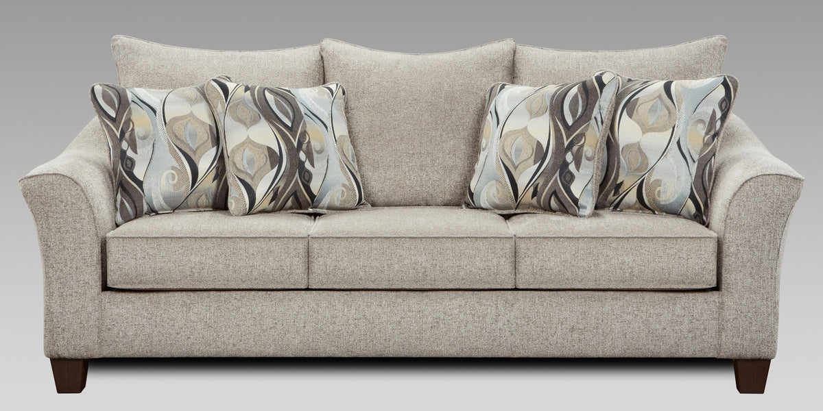 Beige sofa with patterned cushions on a gray background