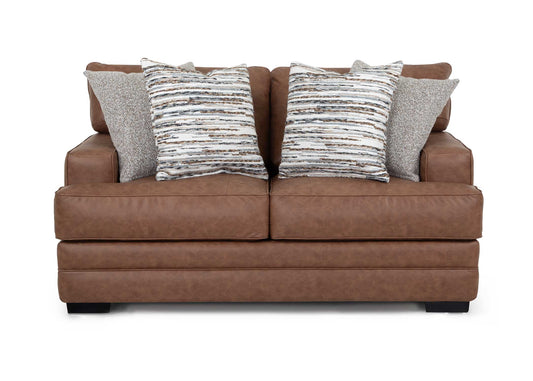 Brown sofa with patterned cushions on a white background
