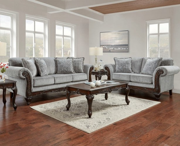 Living room with gray sofa set and wooden coffee table.