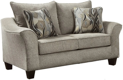Gray loveseat with patterned cushions on a white background