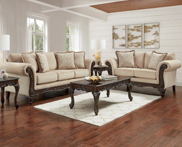 Beige sectional sofa with dark wood frames in a living room setting.